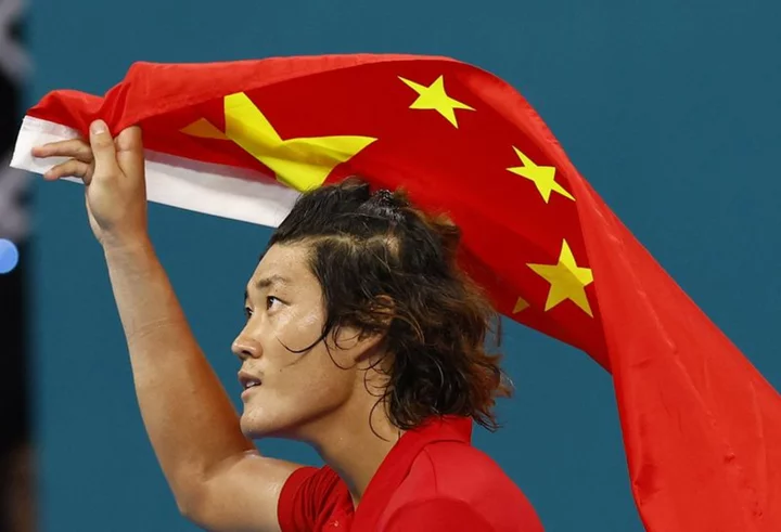 Games-North Korea cheer weightlifting world record, Zhang wins tennis gold